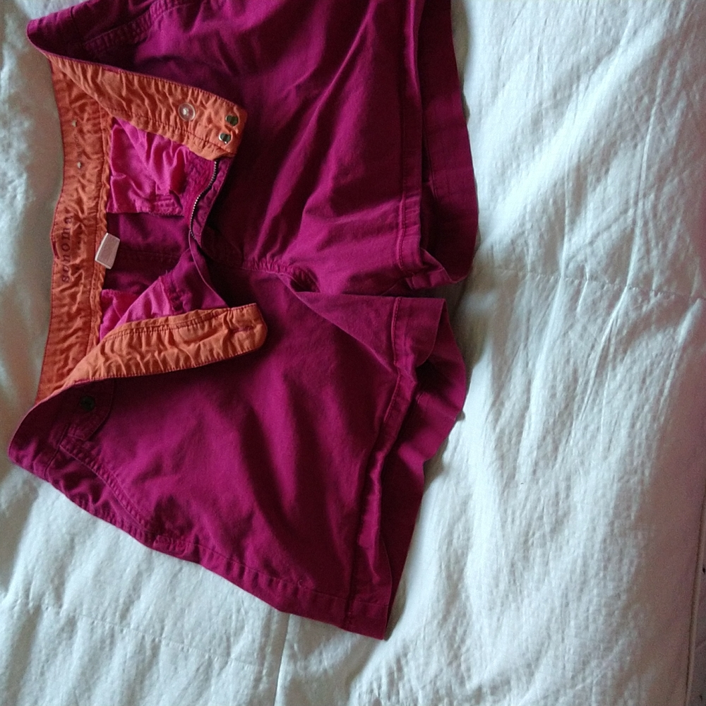 Cute pink shorts with orange lining.